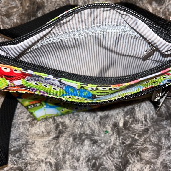 NWT Loungefly Toy Story Alien Outfits AOP Passport Bag - Picture 5 of 5